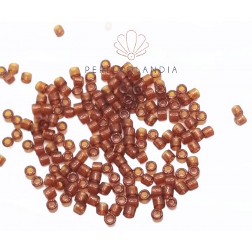 Miyuki Delica 10/0 - Transparent Dark Topaz- 5 Grammi -...